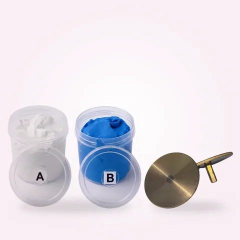 AB silicone putty tubs and a wax model base with stud